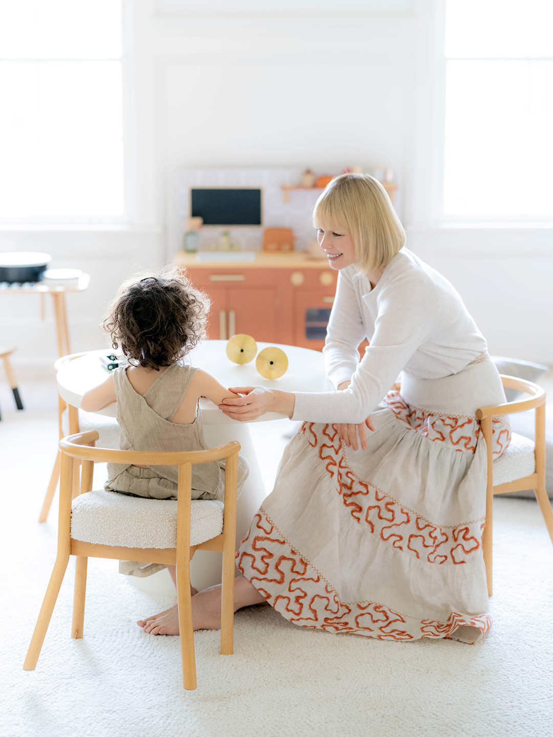 Erin Fetherston playing with her son