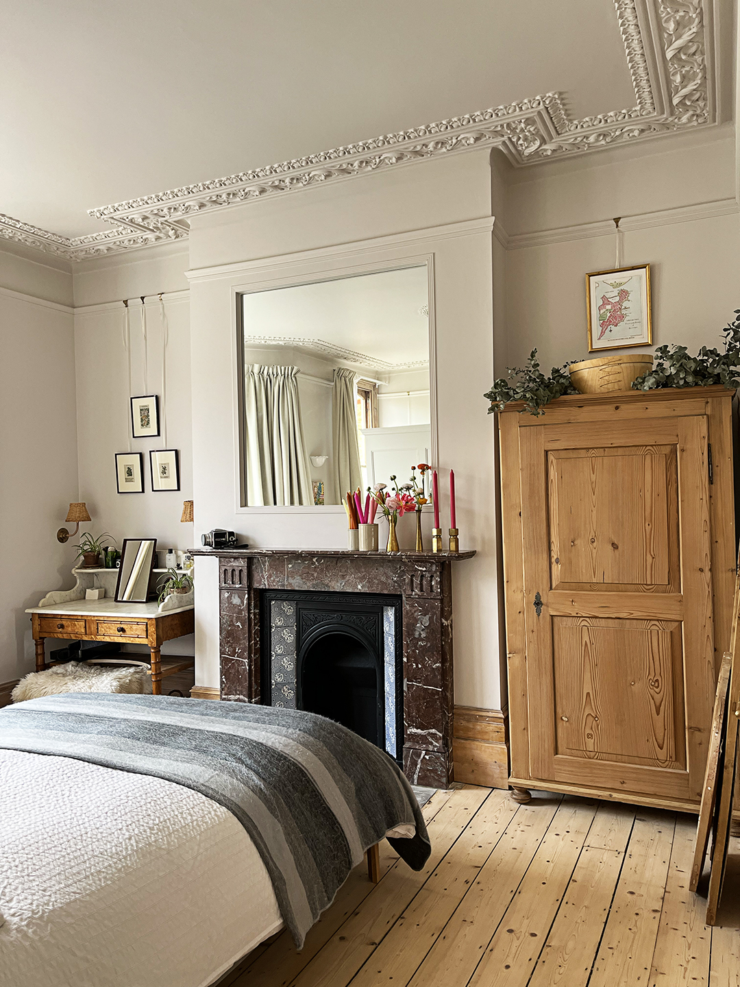 bedroom with stone fireplace