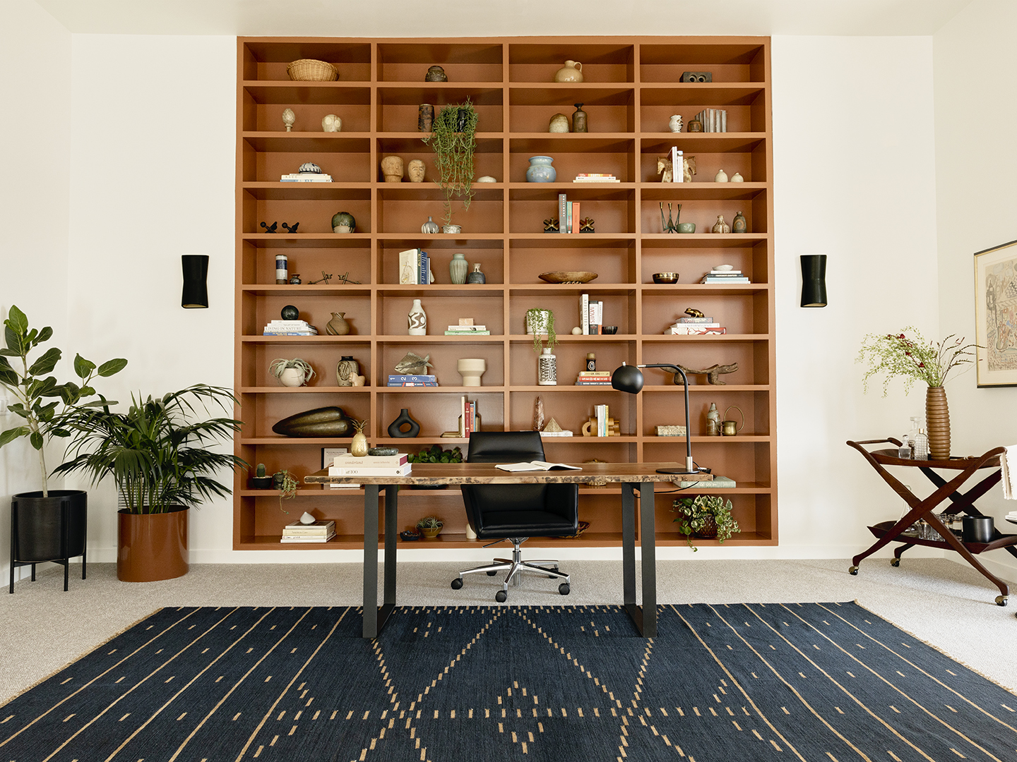 Office with desk, chair, and wood shelving