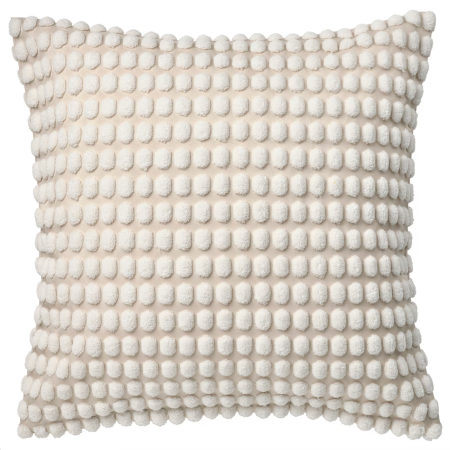  white pillow with pom poms