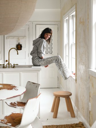 woman sitting on counter