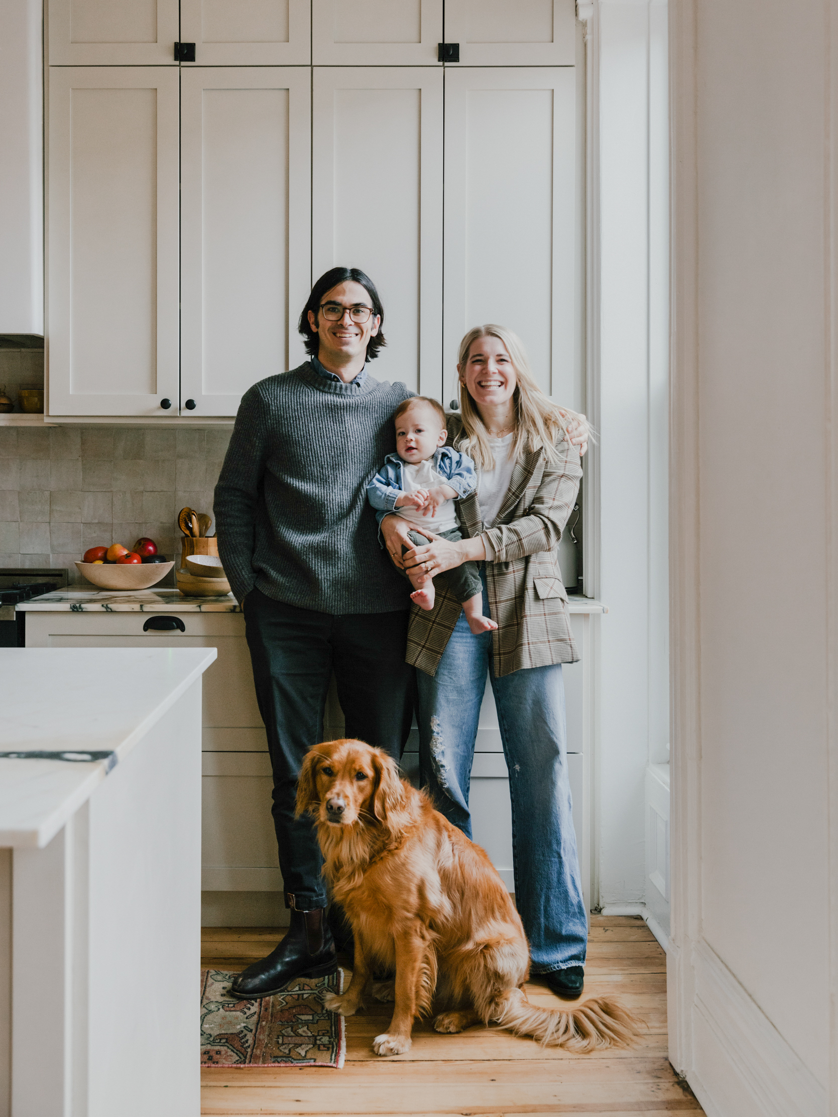 couple with dog and baby