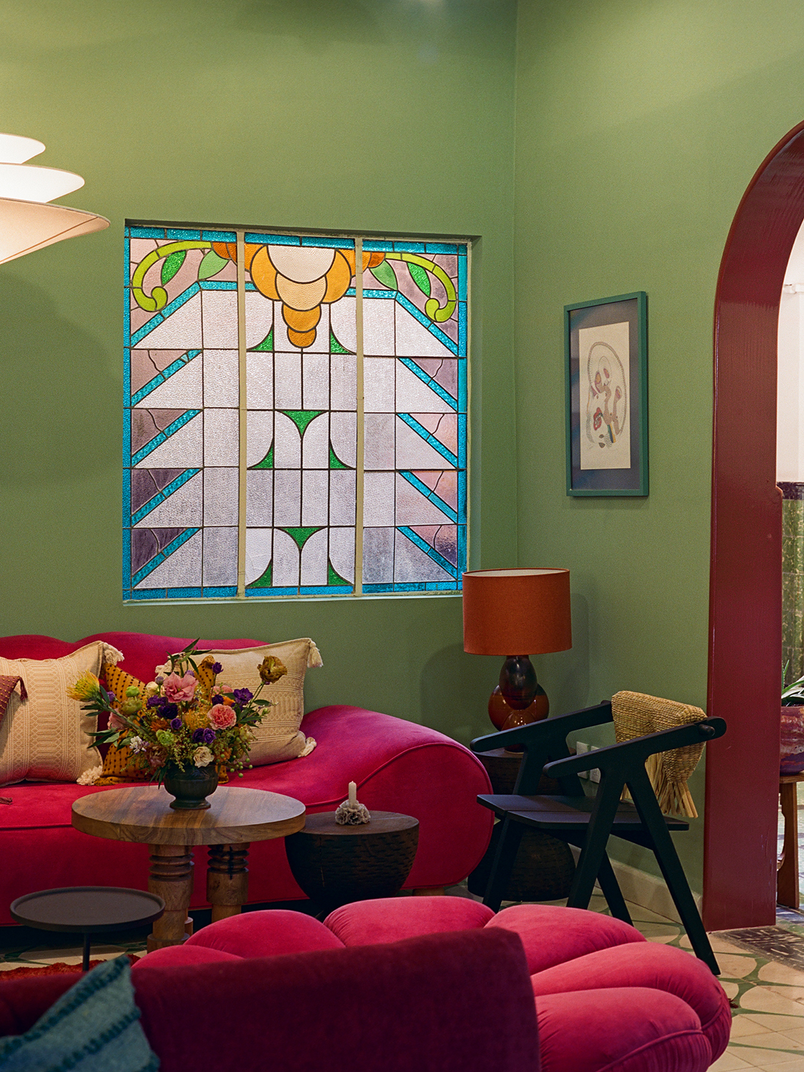 Original stained glass window and green walls in lobby