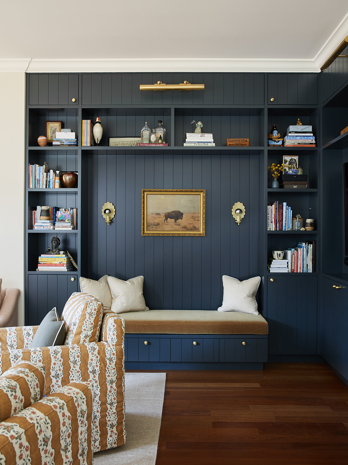 Living room with built-in shelves painted navy