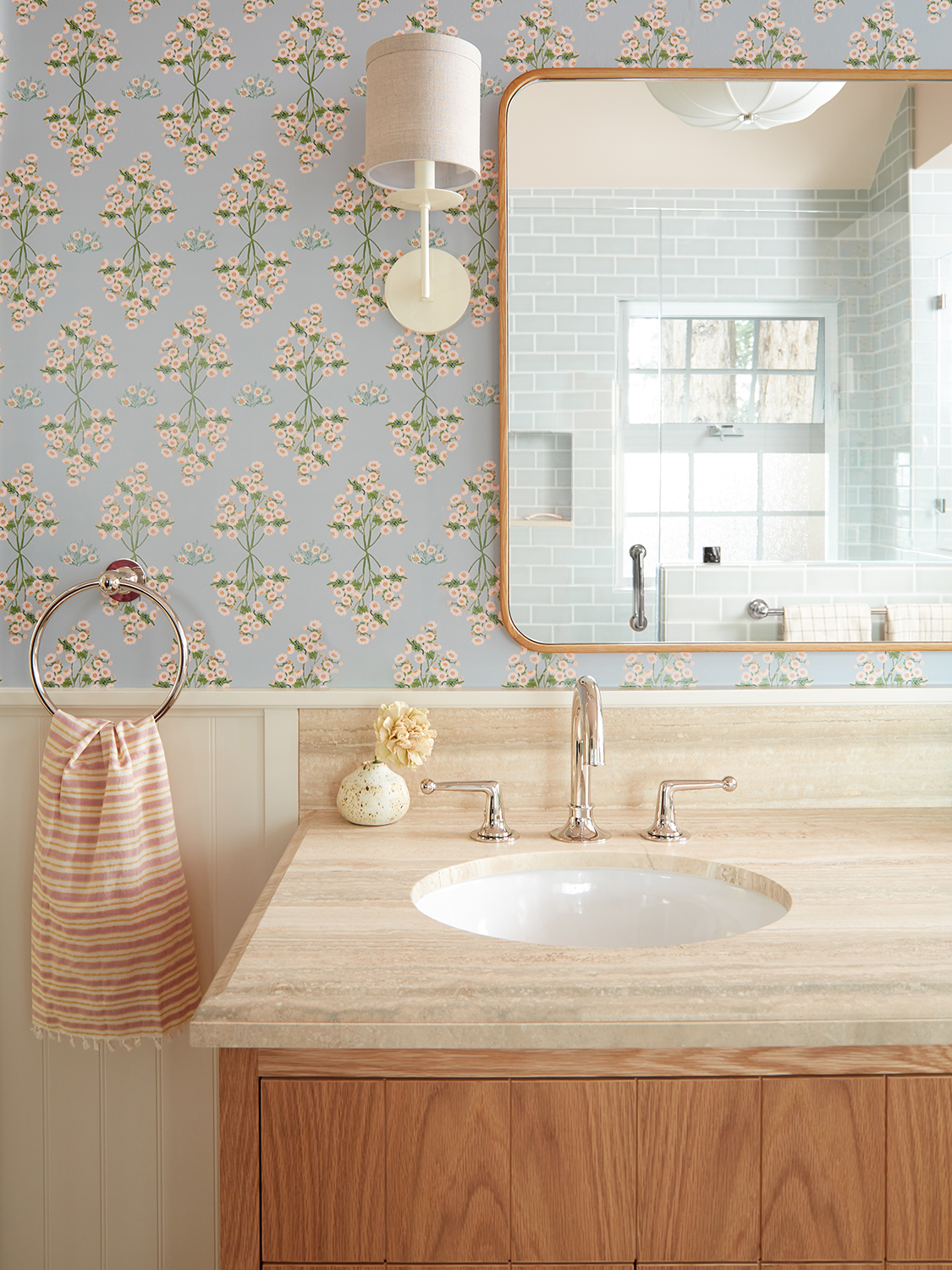 Blue bathroom wallpaper and sink