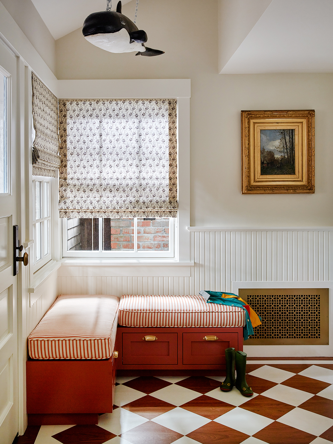 Entryway with orca whale hanging above and checkerboard on floor