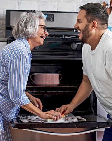 Dan Pelosi and his mom cleaning an oven