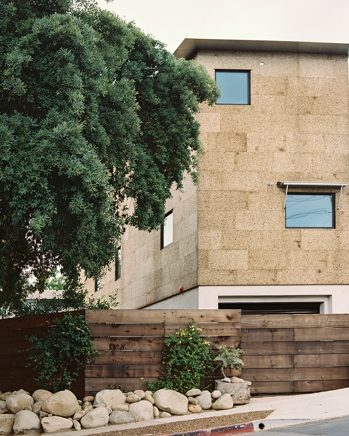 cork exterior with wood fence