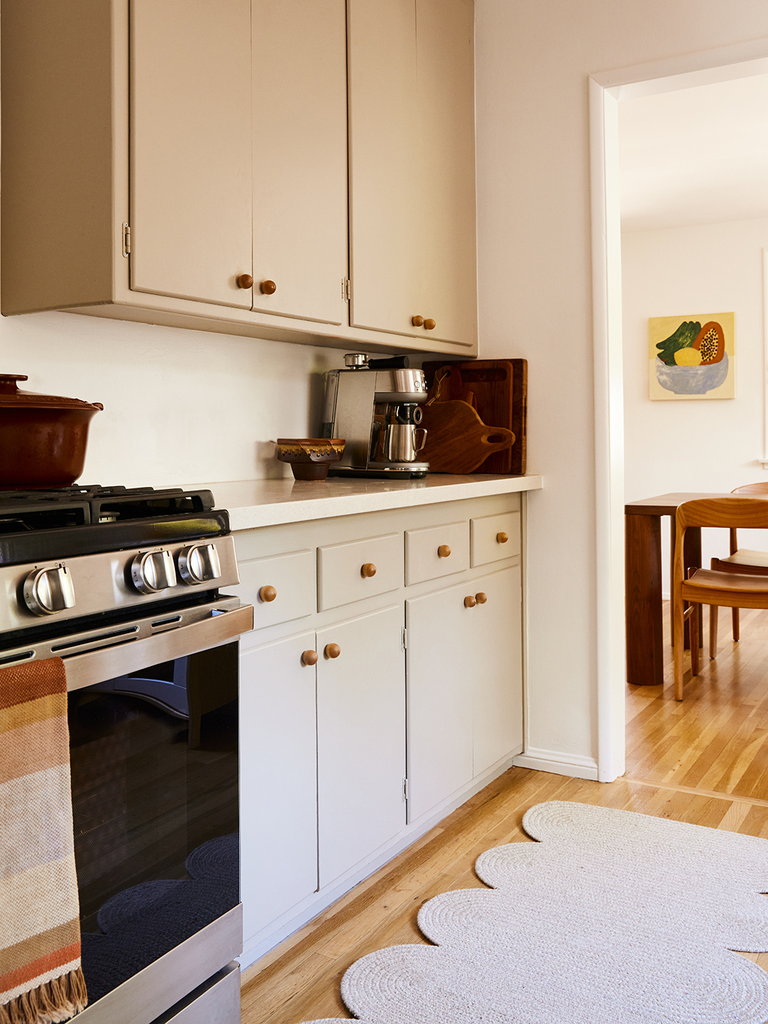 gray kitchen cabinets with ball knobs