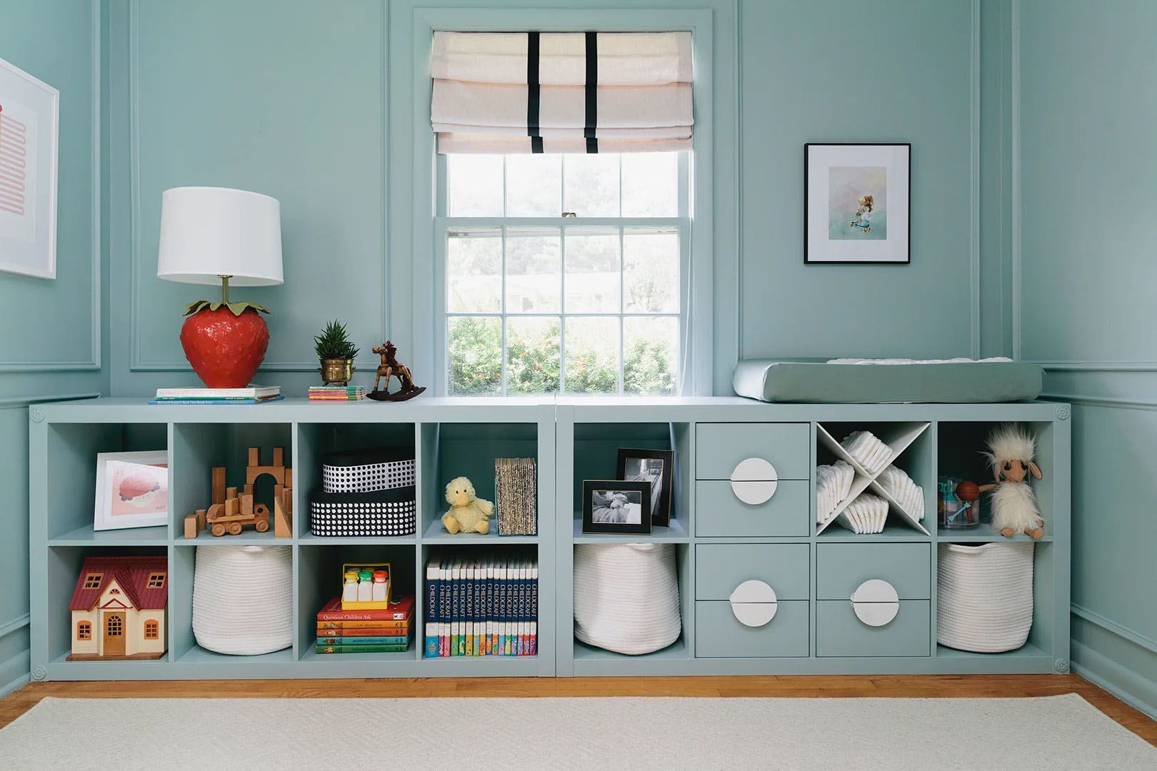 nursery with low blue IKEA shelving units