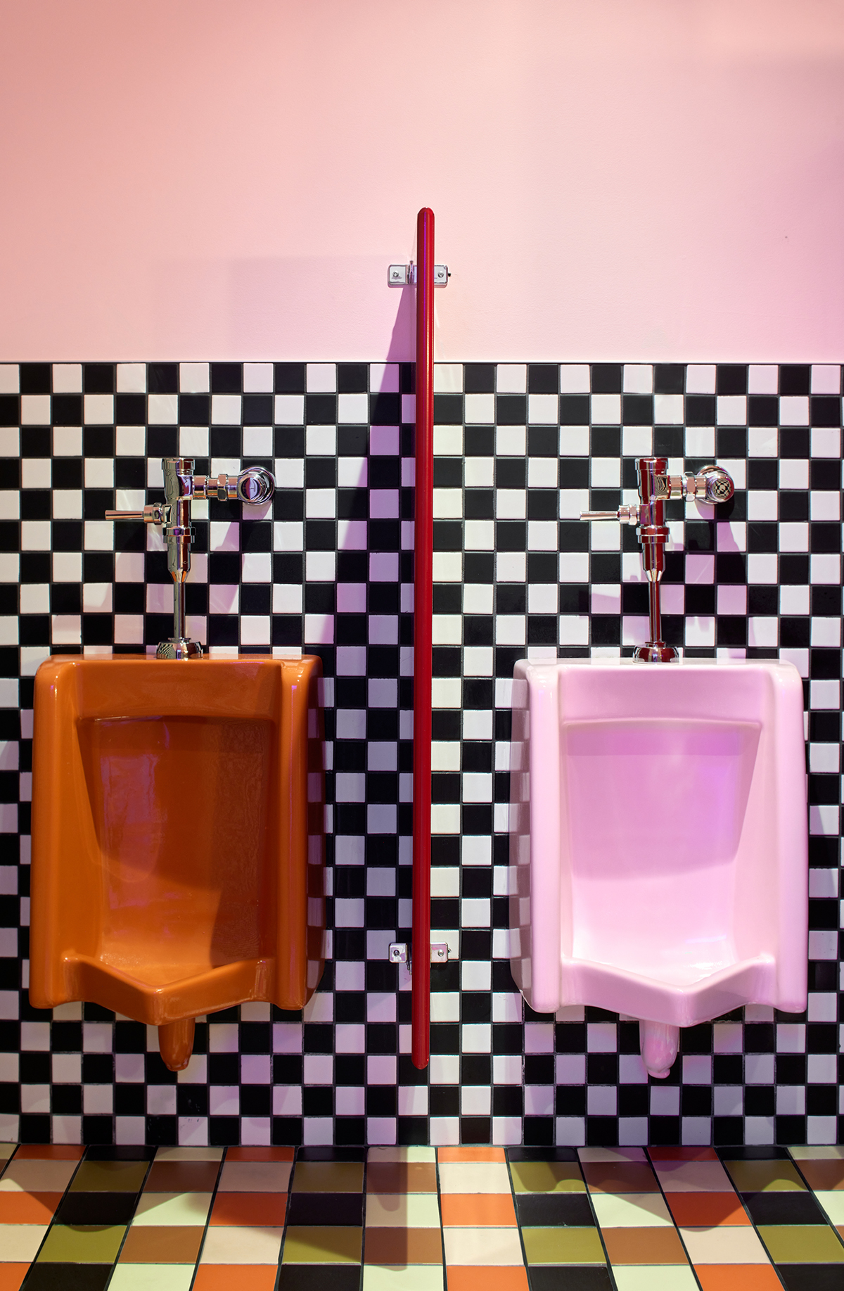 orange and pink urinals