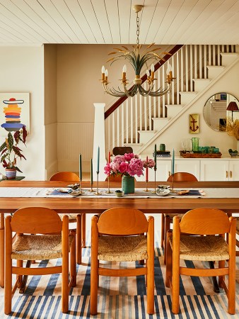 Dining table with wooden chairs and french floral chandelier