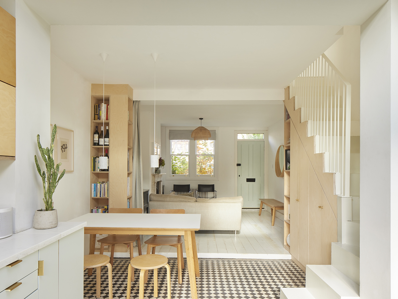 open living and dining area with check floors