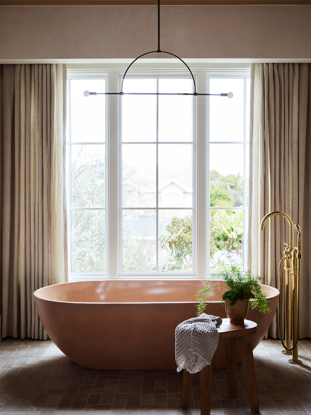 primary bathroom pink bathtub