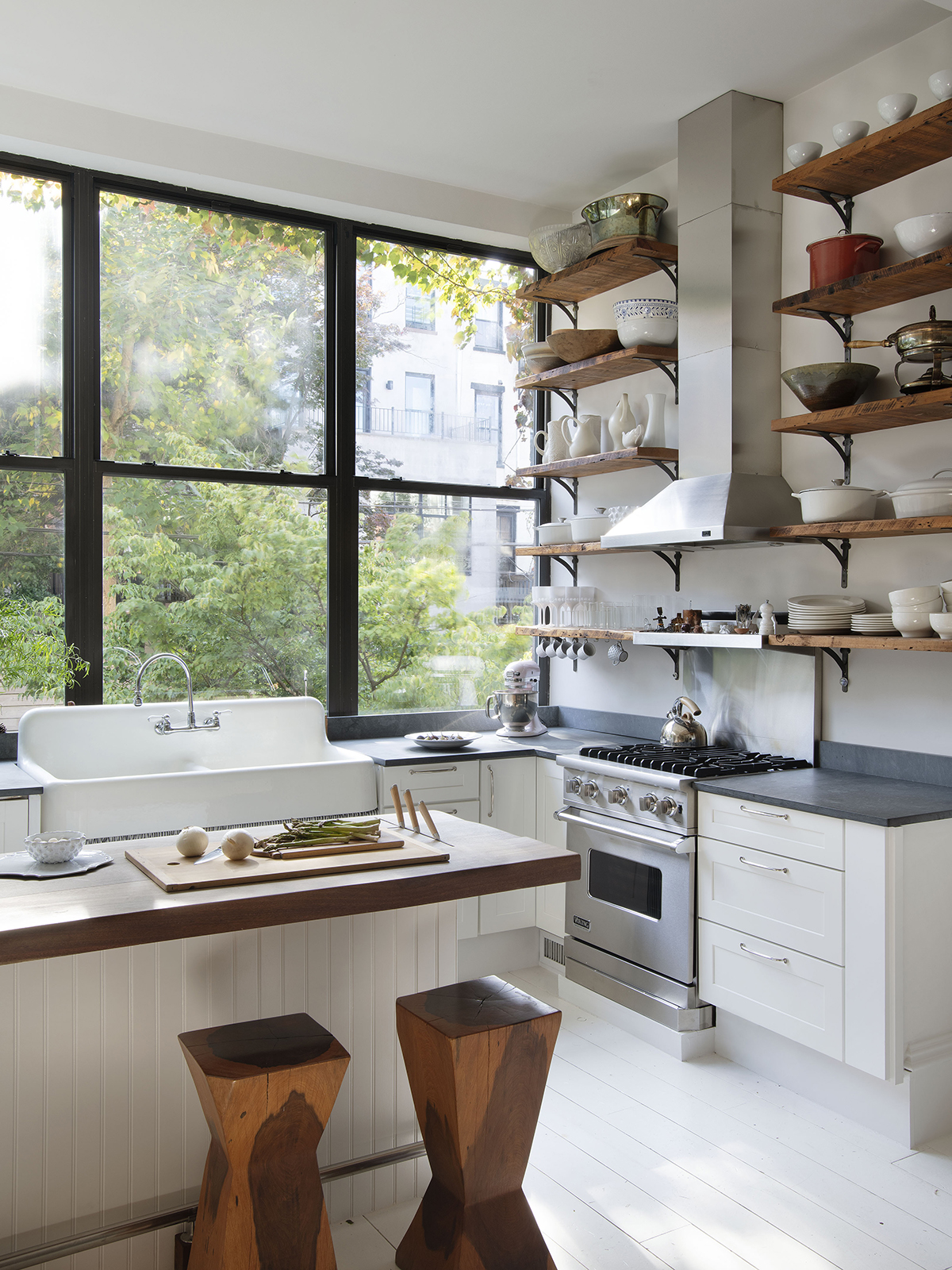 Kitchen with open shelving along wall