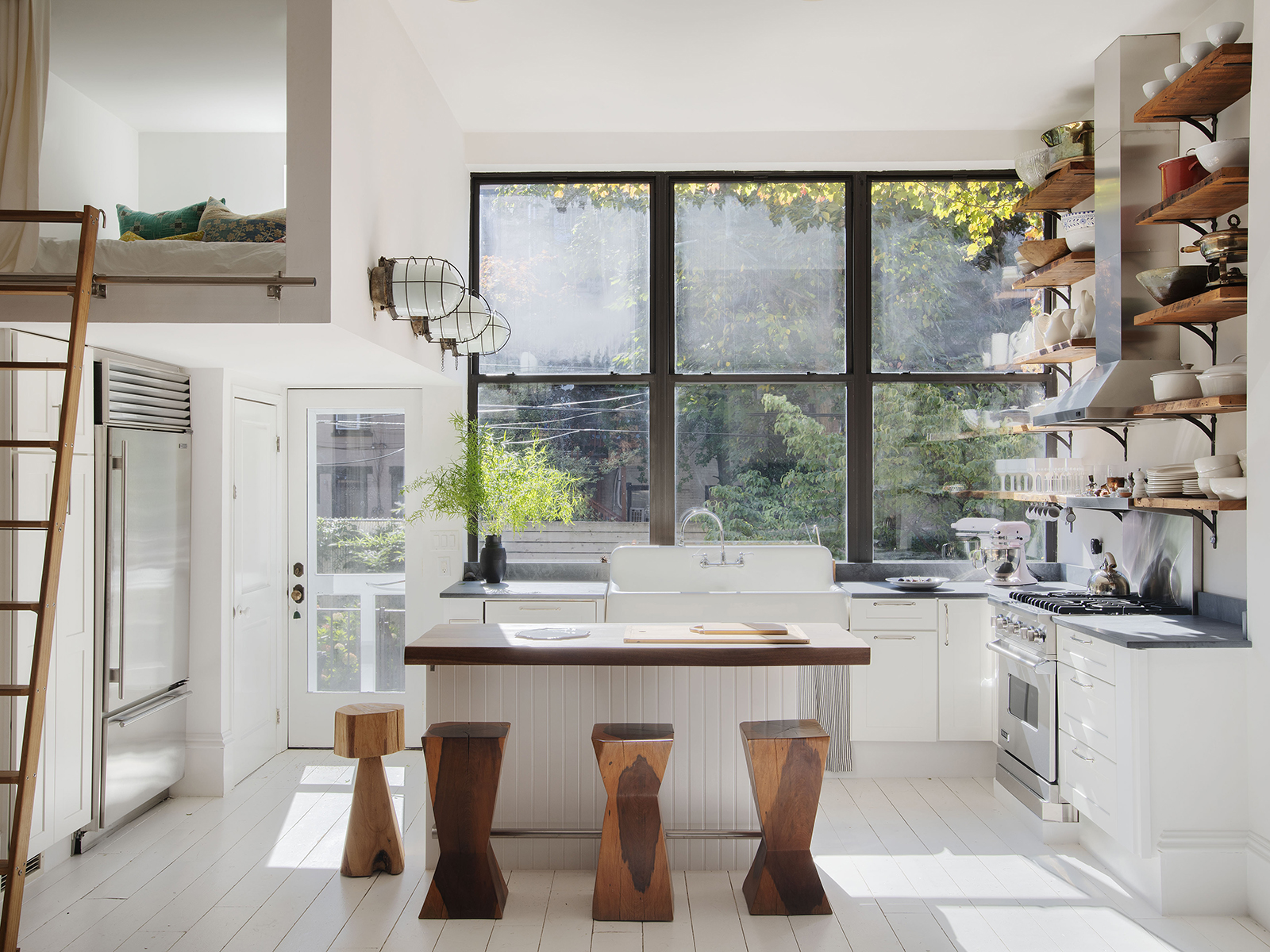 Kitchen with sleeping nook above