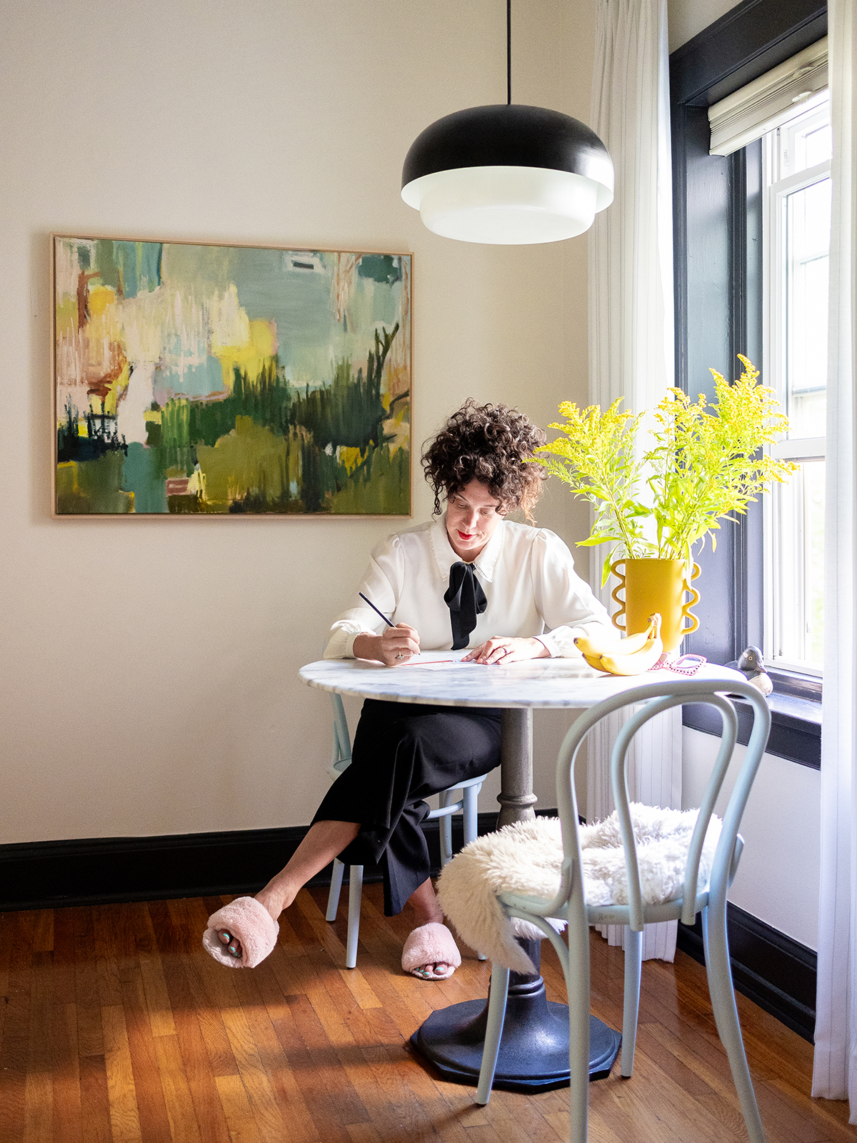 woman working at dining table