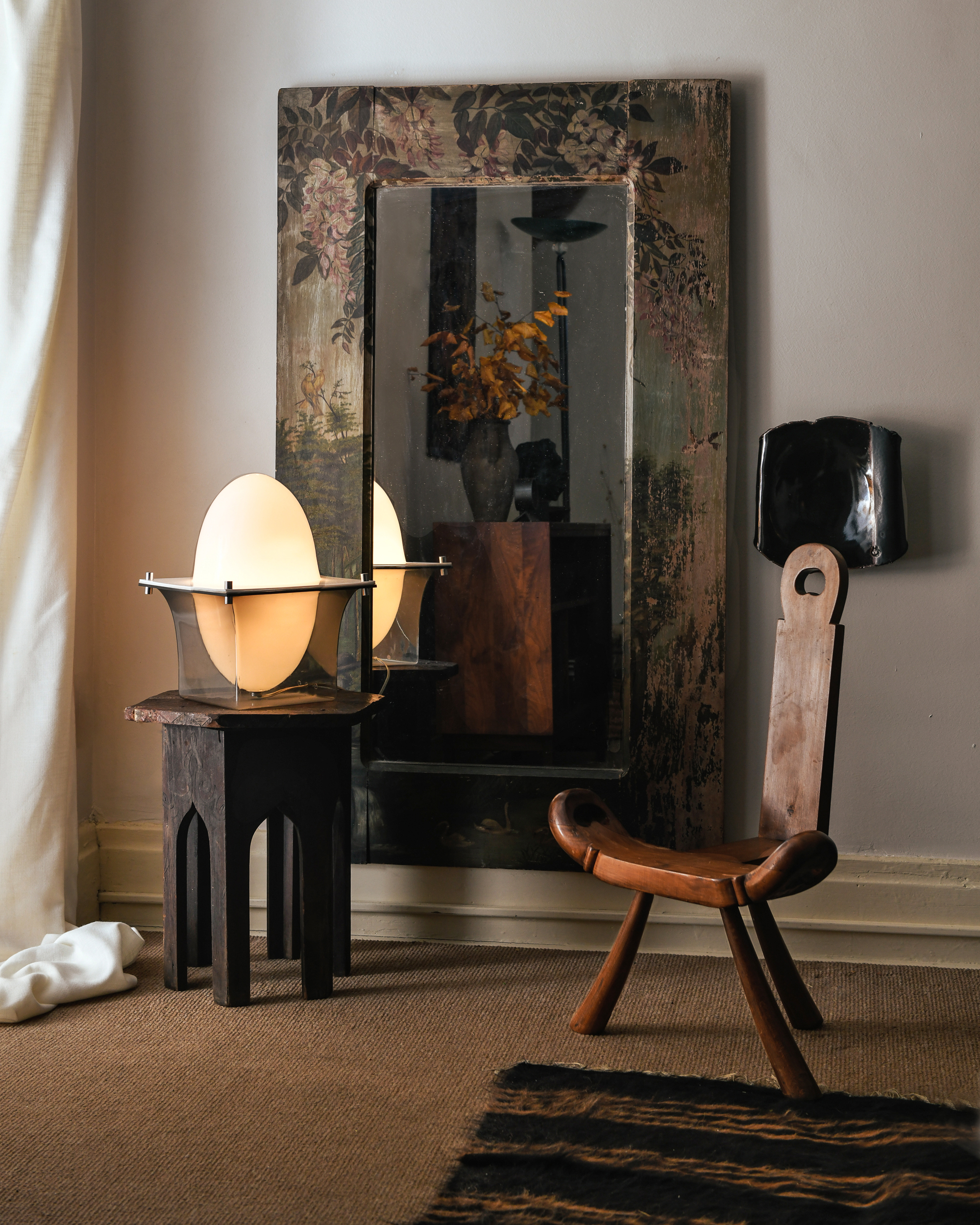 Wooden chair next to 1970s egg lamp