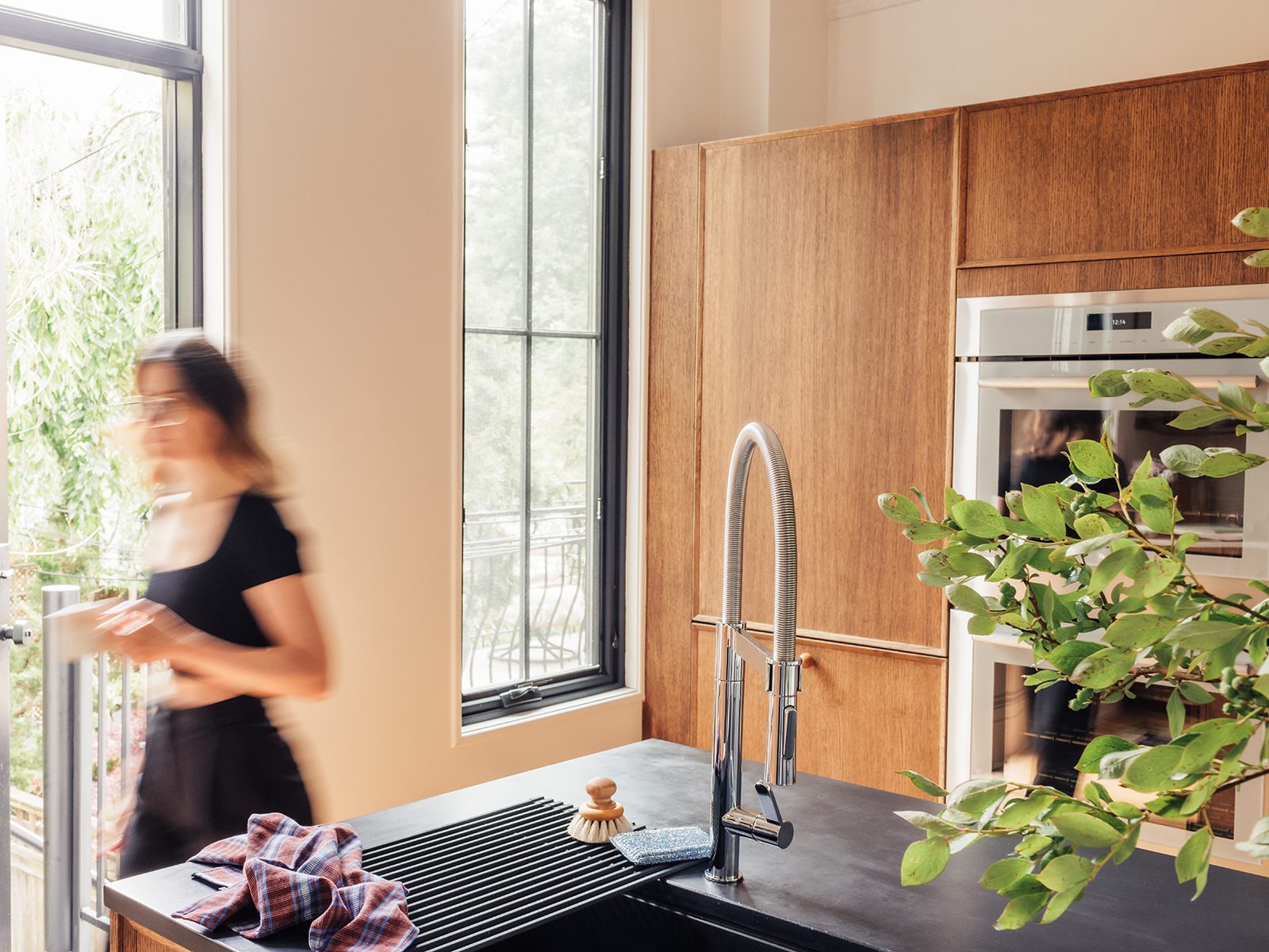 woman walking around kitchen