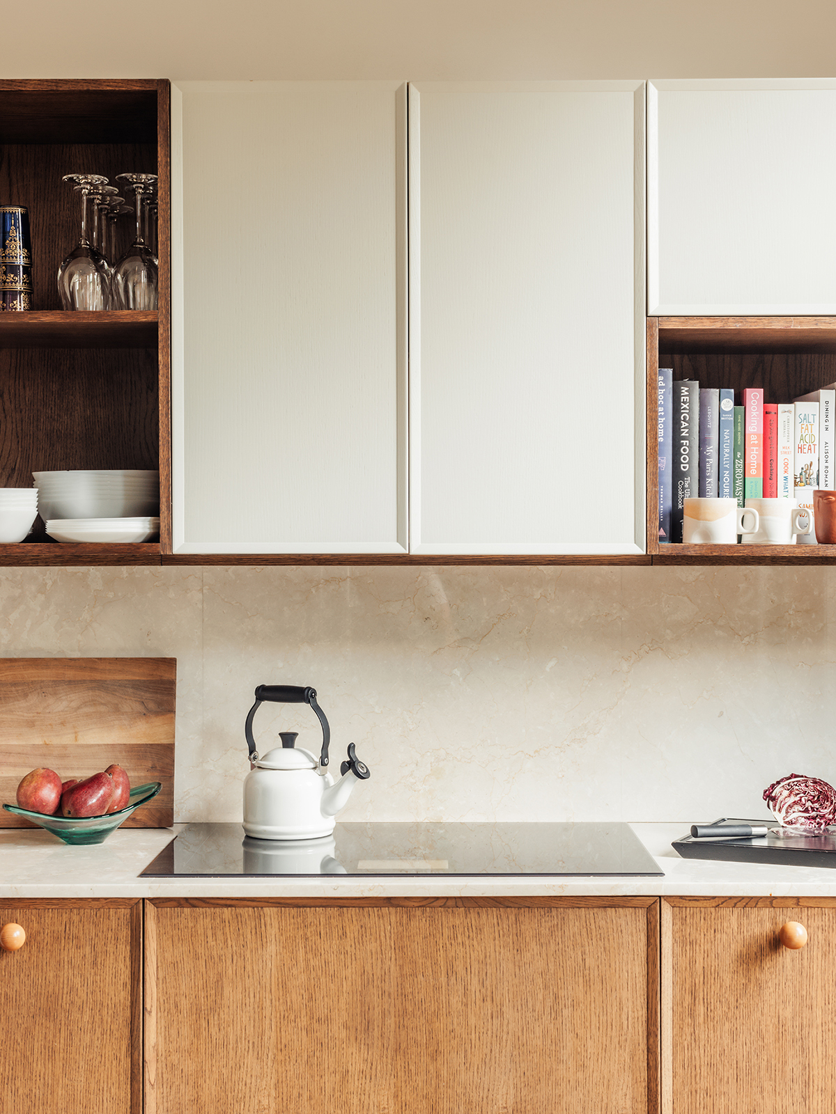 lower wood walnut cabinets and white uppers