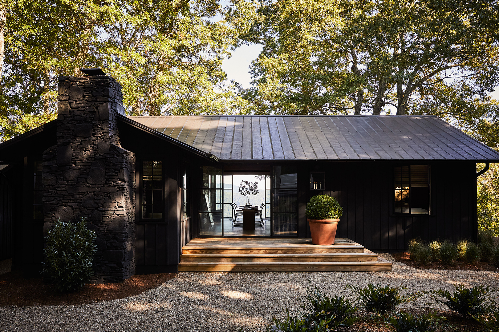 Brick mountain cabin painted black.