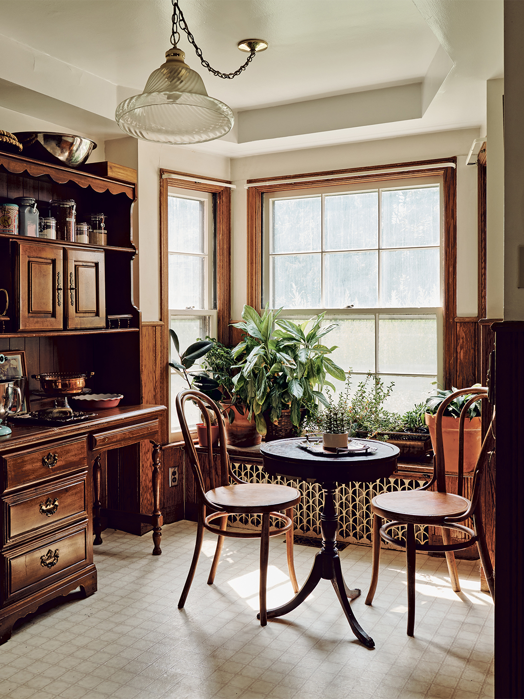 Cafe table with two wooden chairs