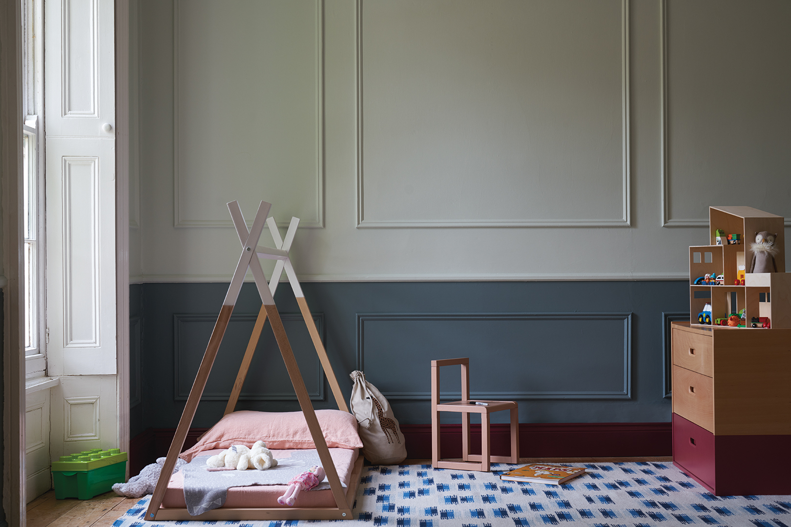 nursery room with wall paneling