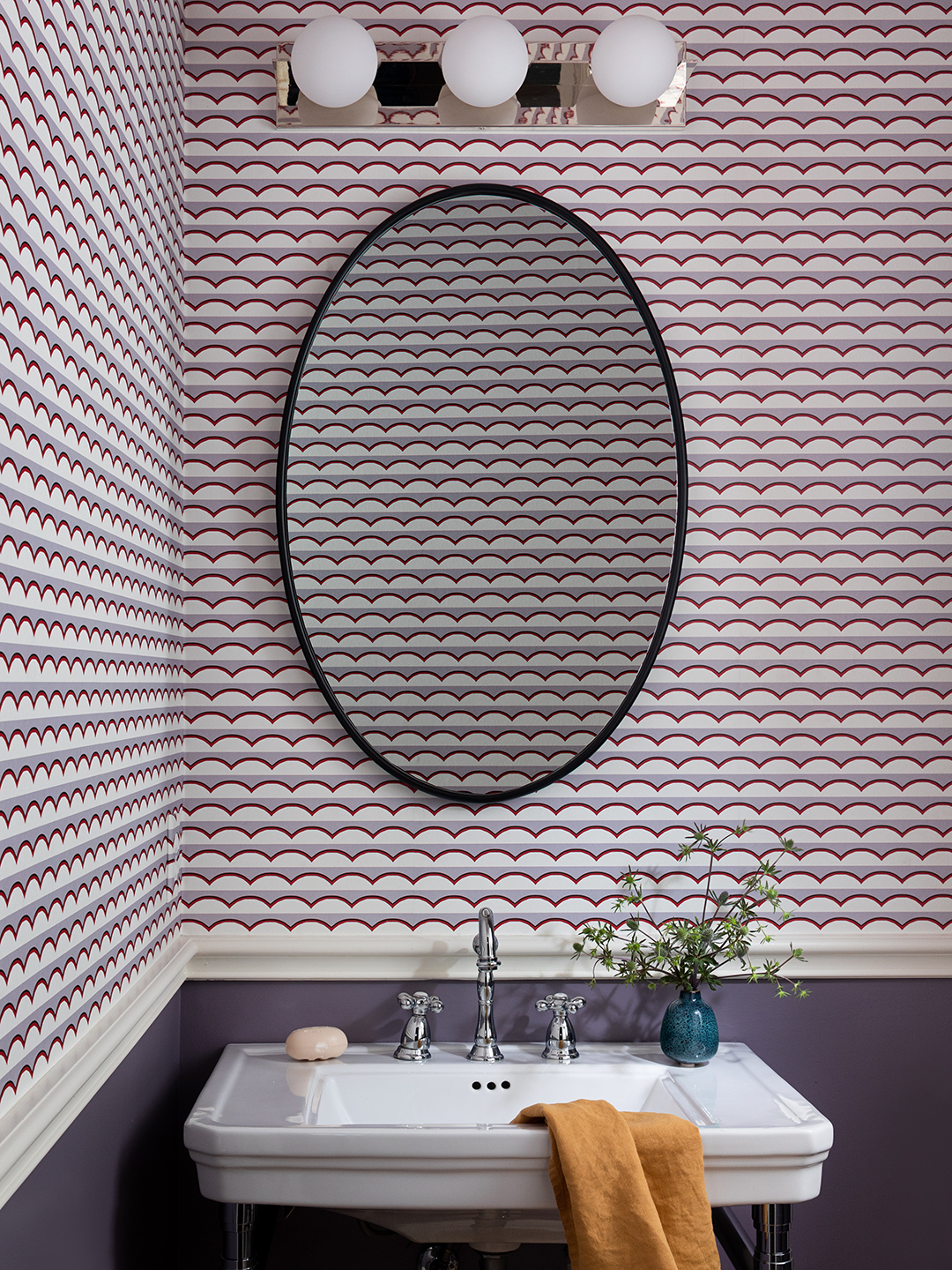 pink wallpapered powder bathroom