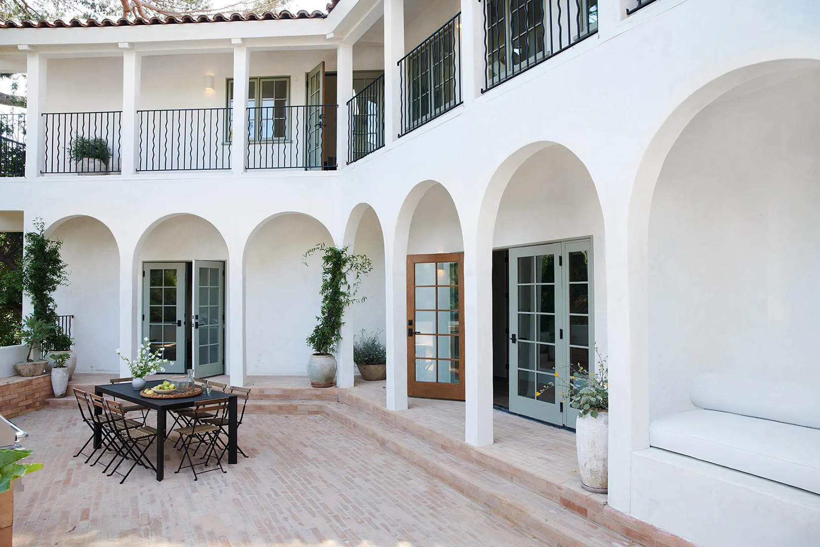 white archways around a patio