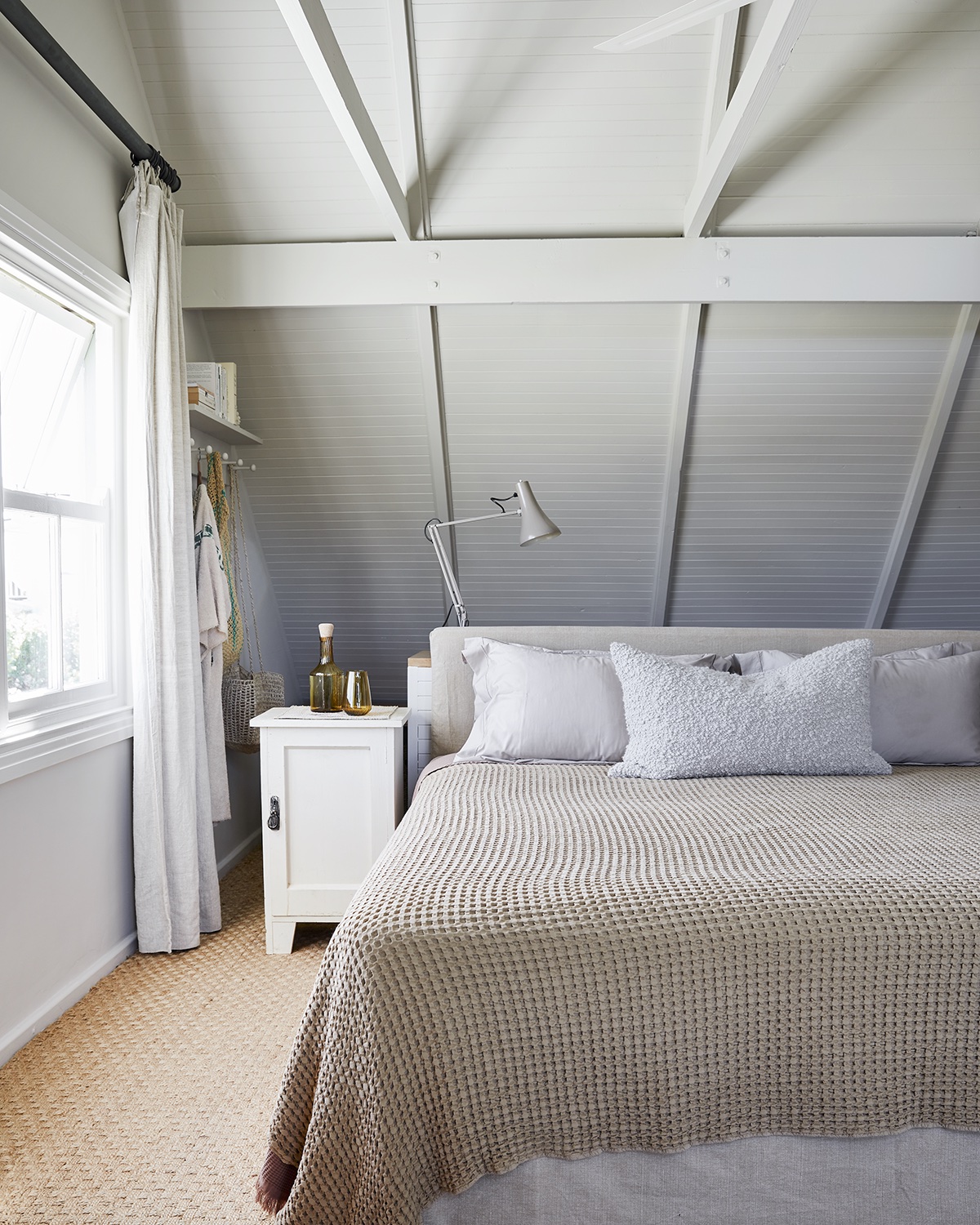 bedroom with white sloped ceiling