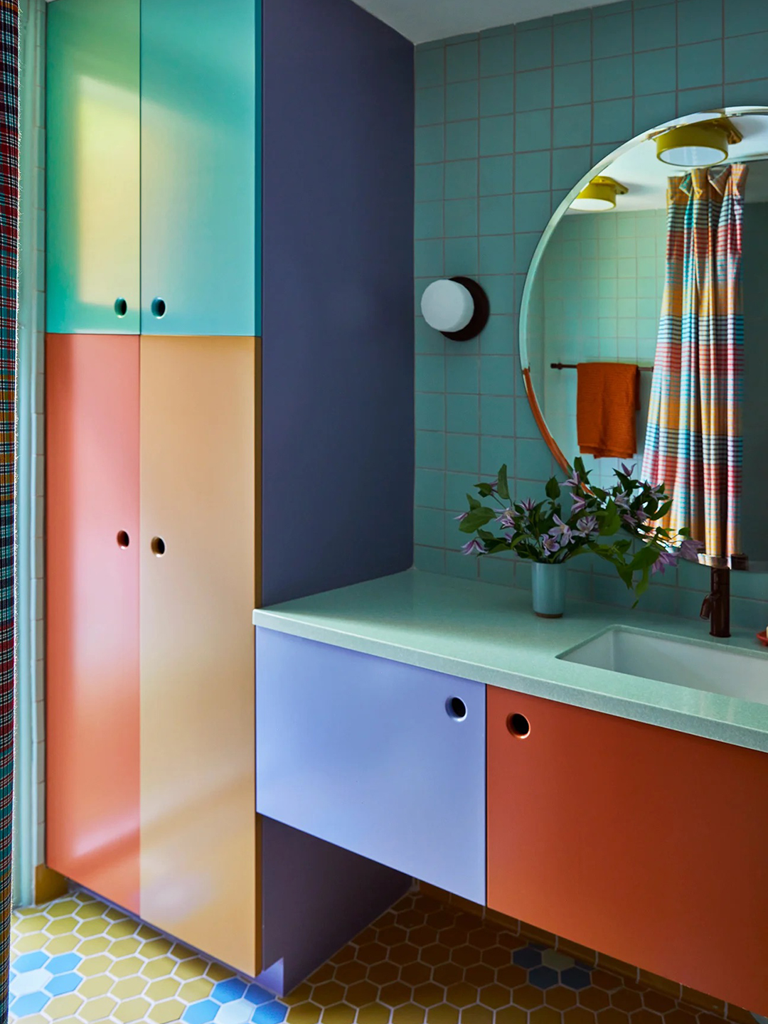 Bathroom with color-blocked cabinets.