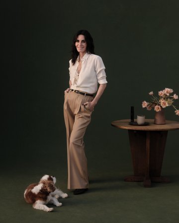 Woman in white shirt and tan pants