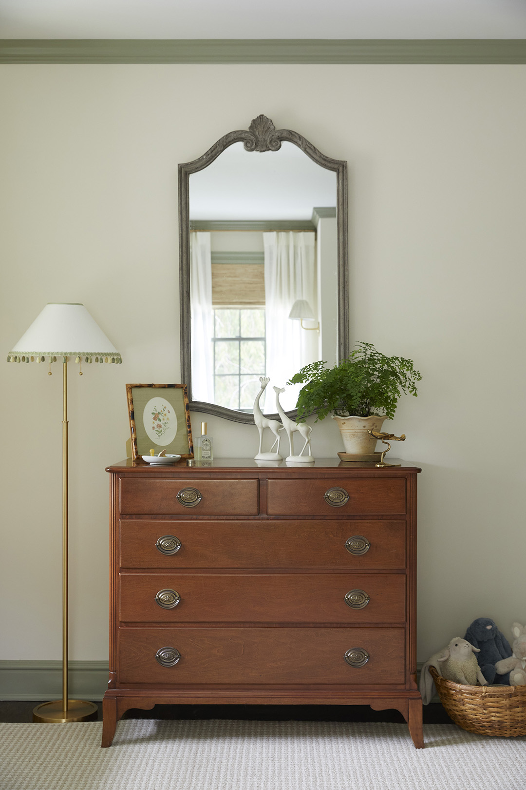 Antique wood dresser in nursery.