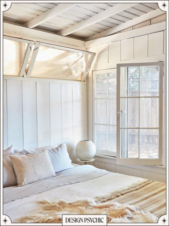 Neutral bedroom with windows