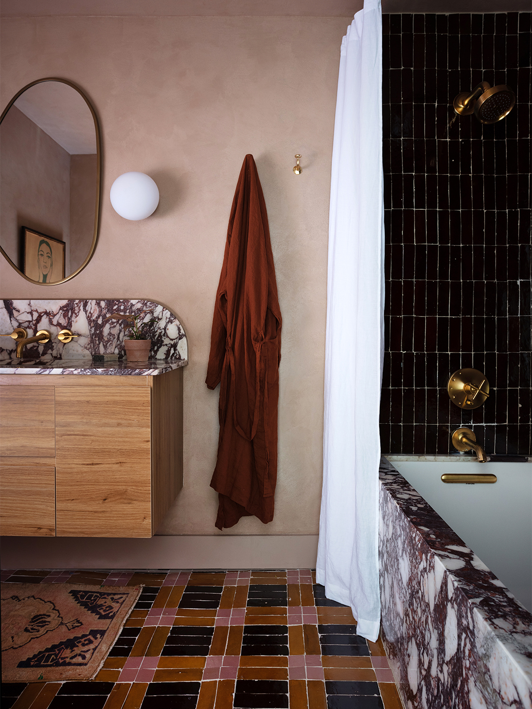 pink bathroom with patchwork tile floor