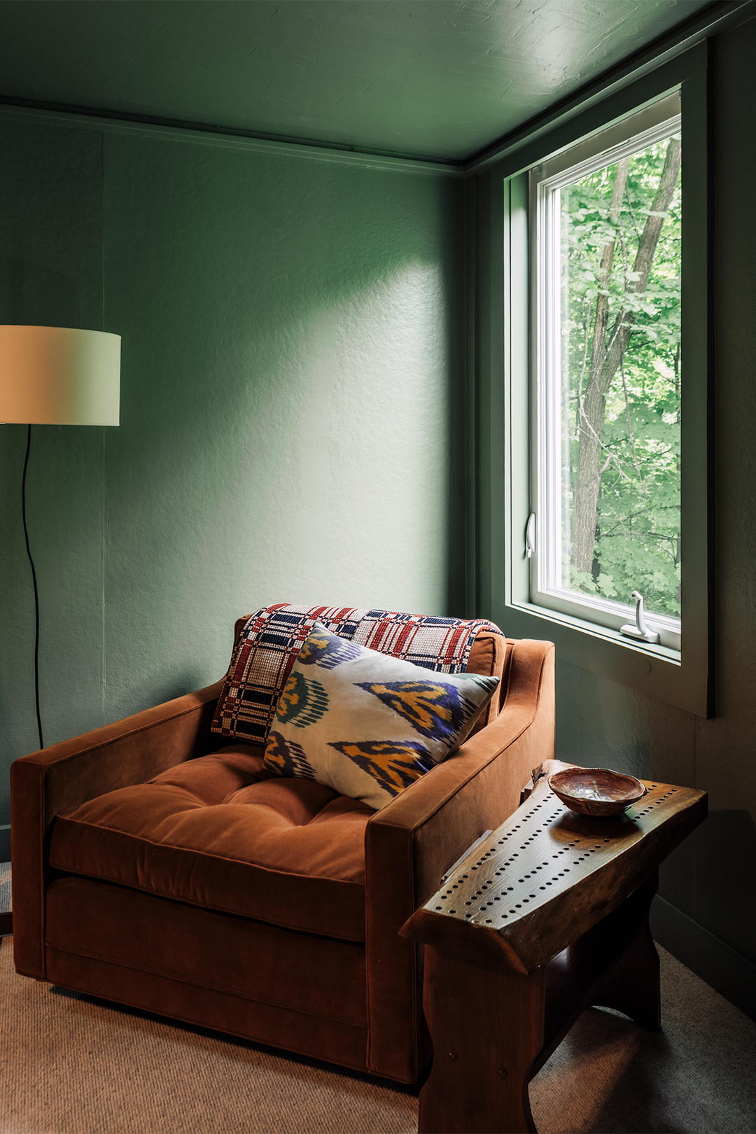 orange chair in green room