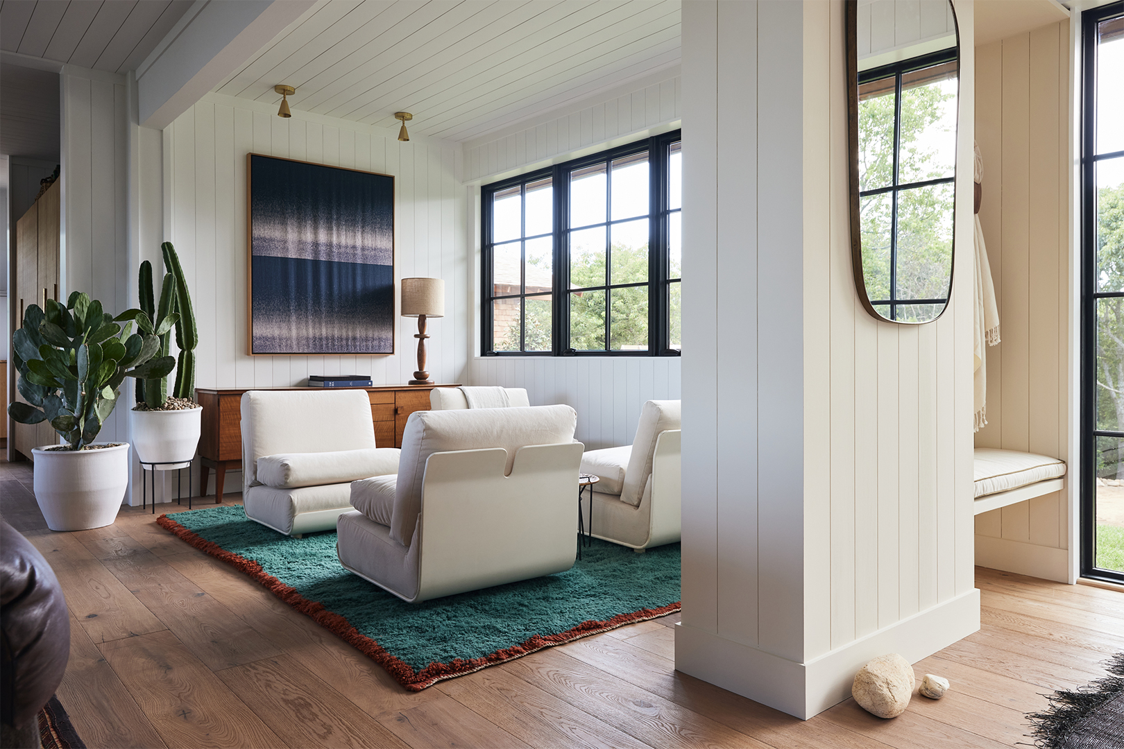 living room with white walls and white furniture