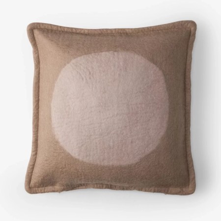  Brown pillow with pink circle in the middle