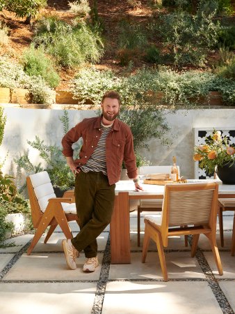 Man standing in front of outdoor dining room table