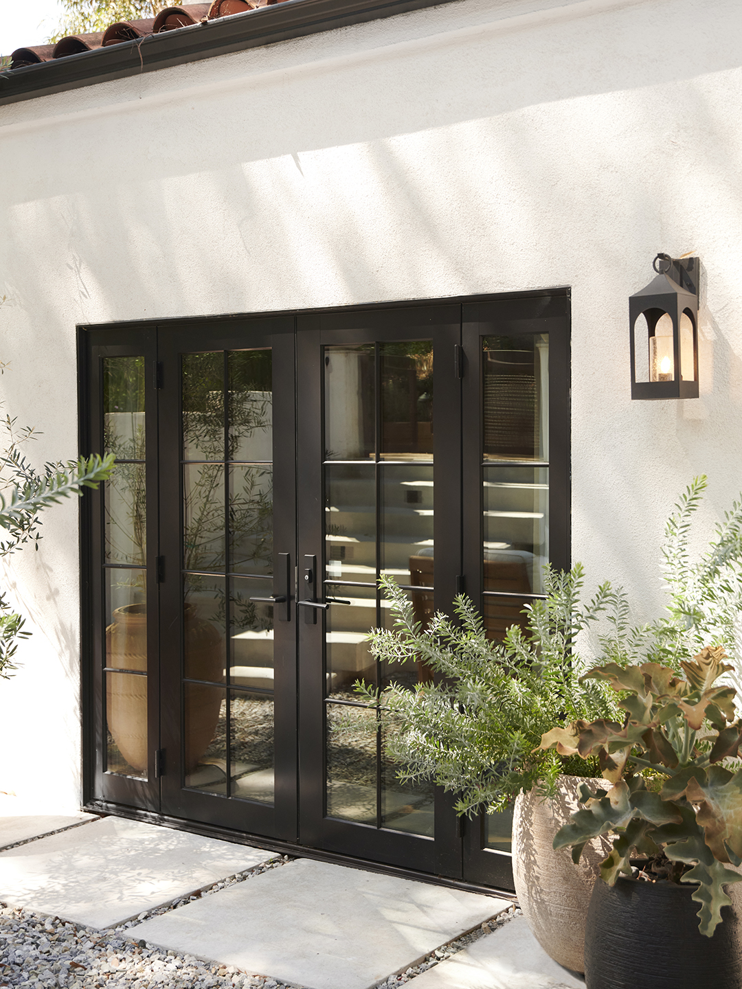 the back door, after with potted plants