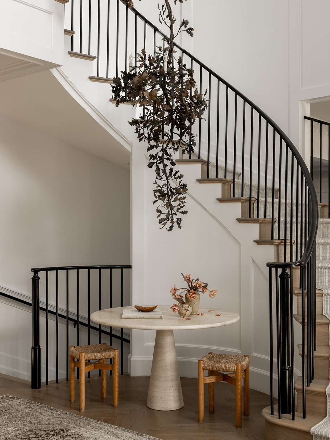 Staircase with tree chandelier