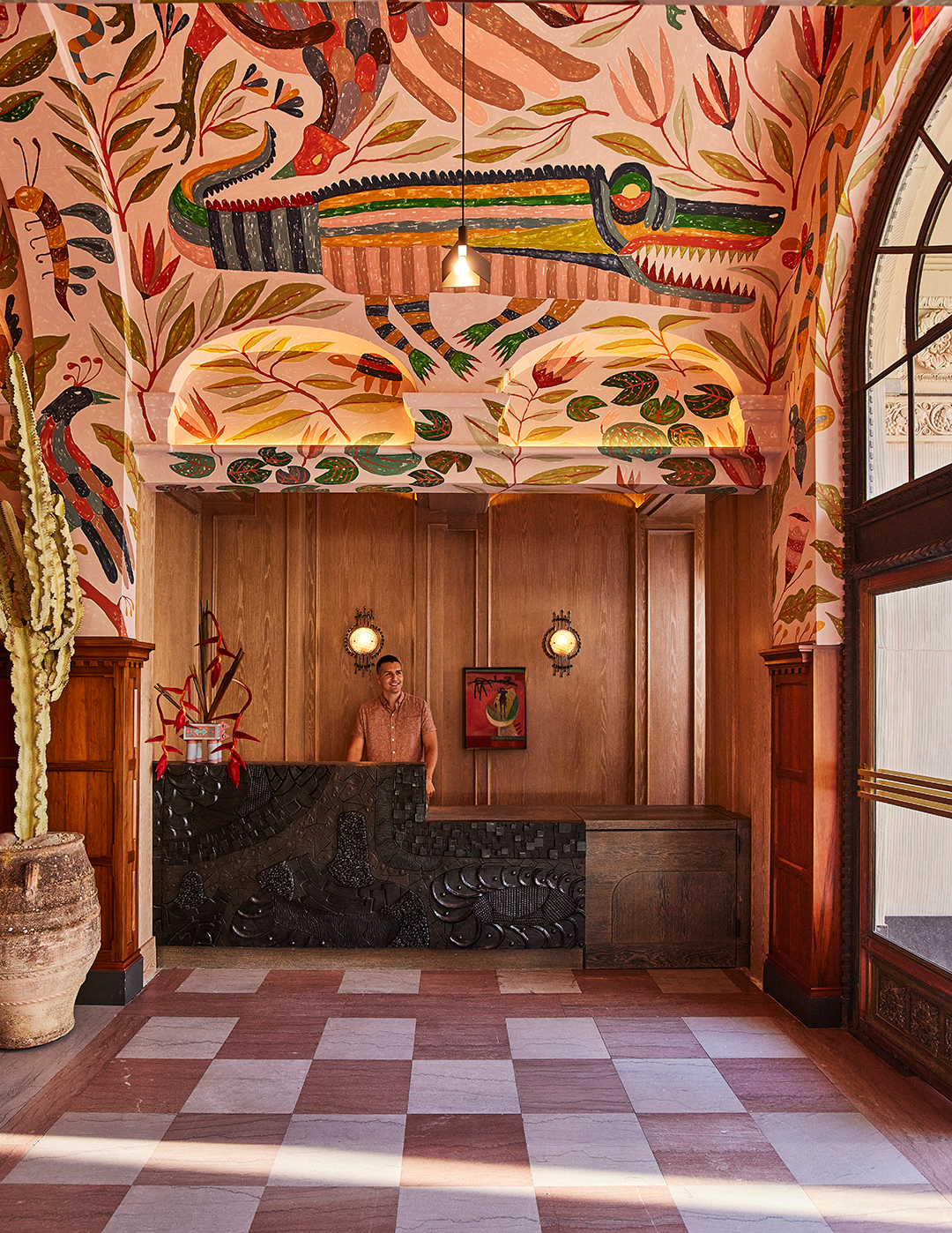 Hotel lobby with desert-colored mural