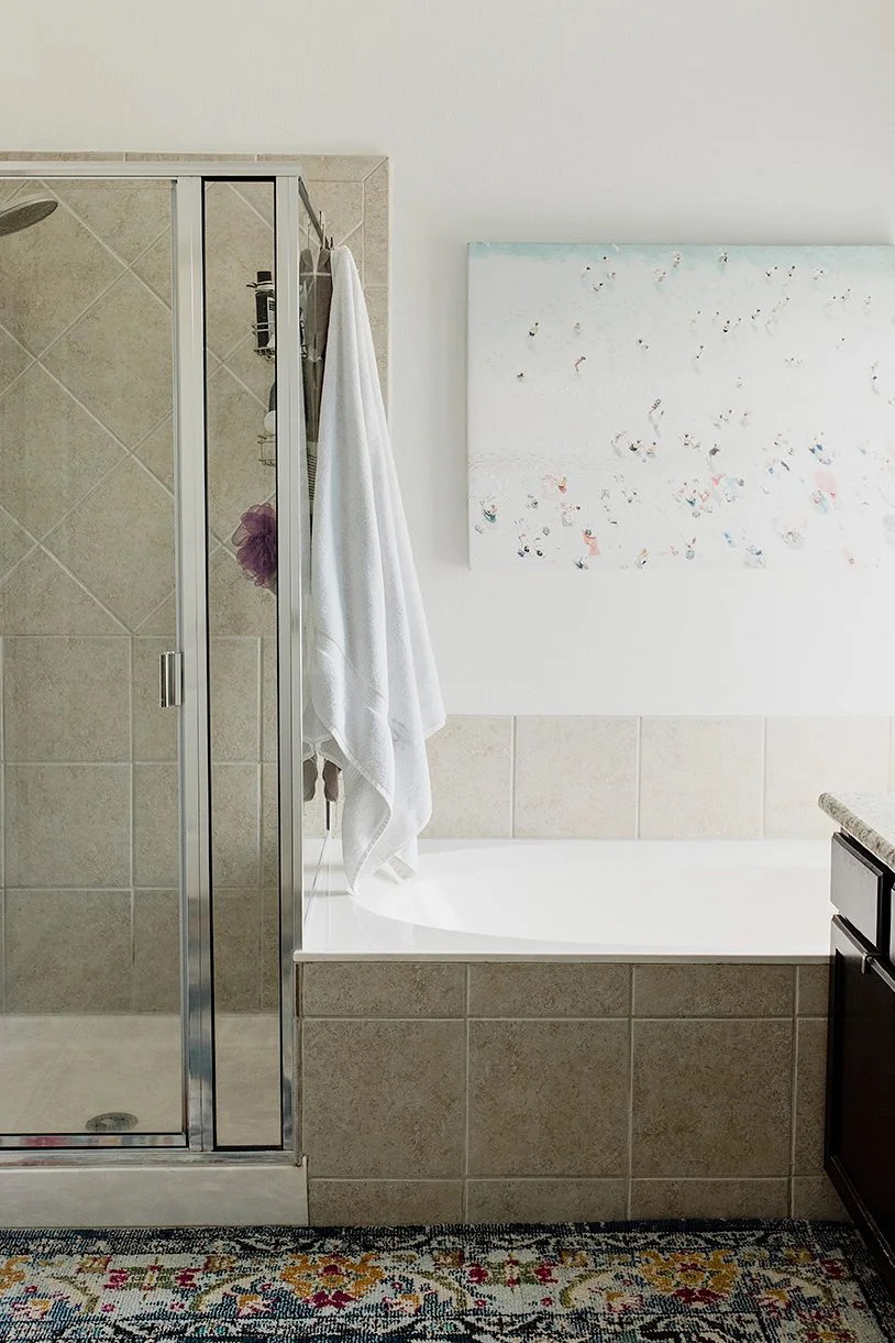 dated tub next to a shower