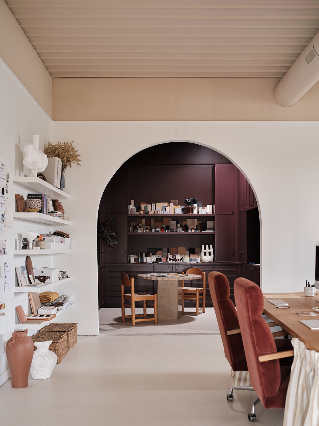 Office view into a archway with dark walls