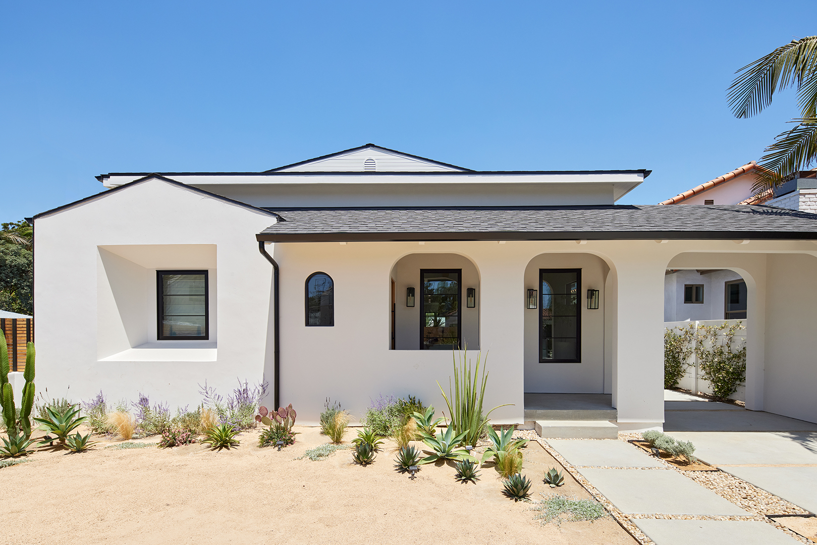 white home withe desert landscaping