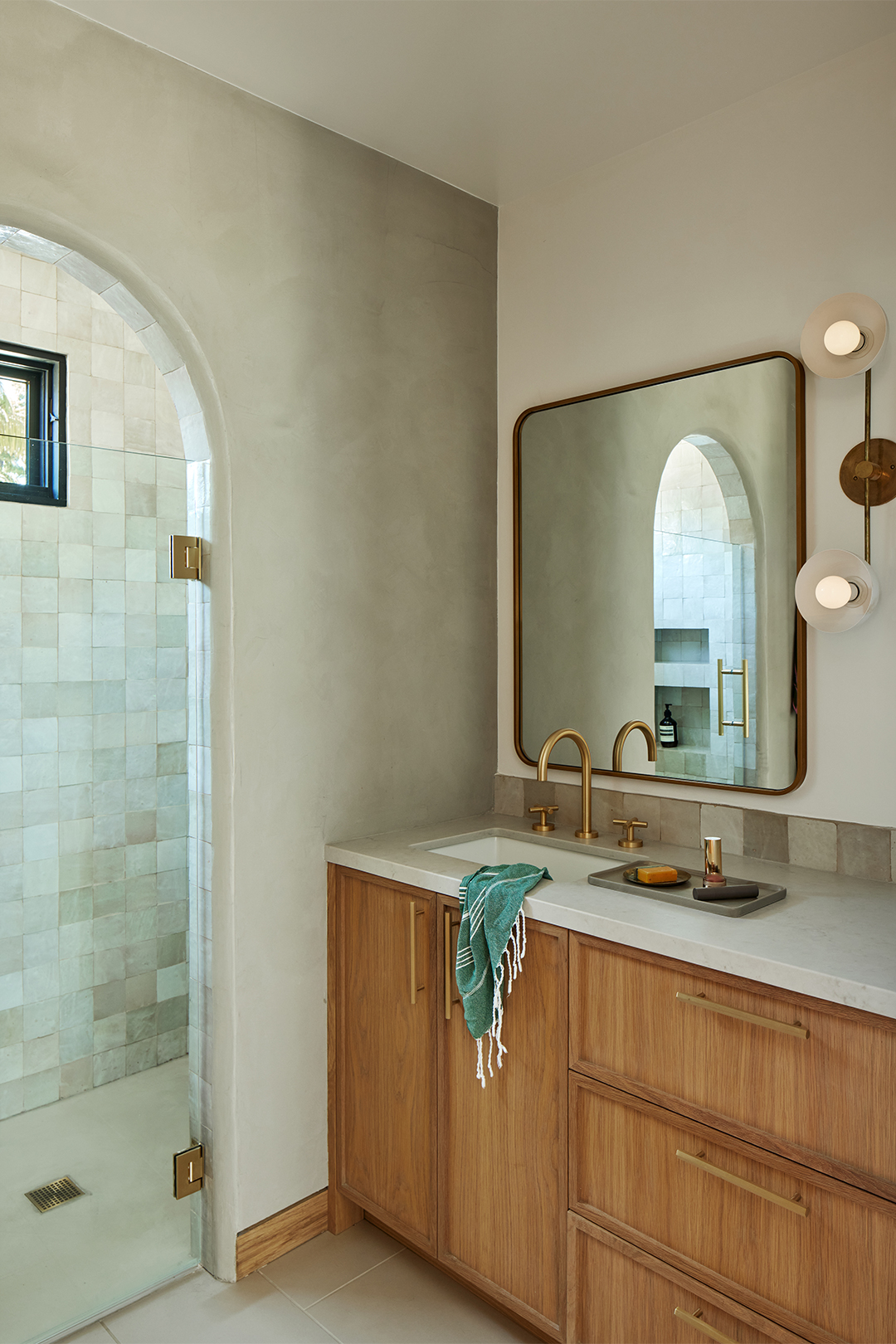 bathroom with arched shower