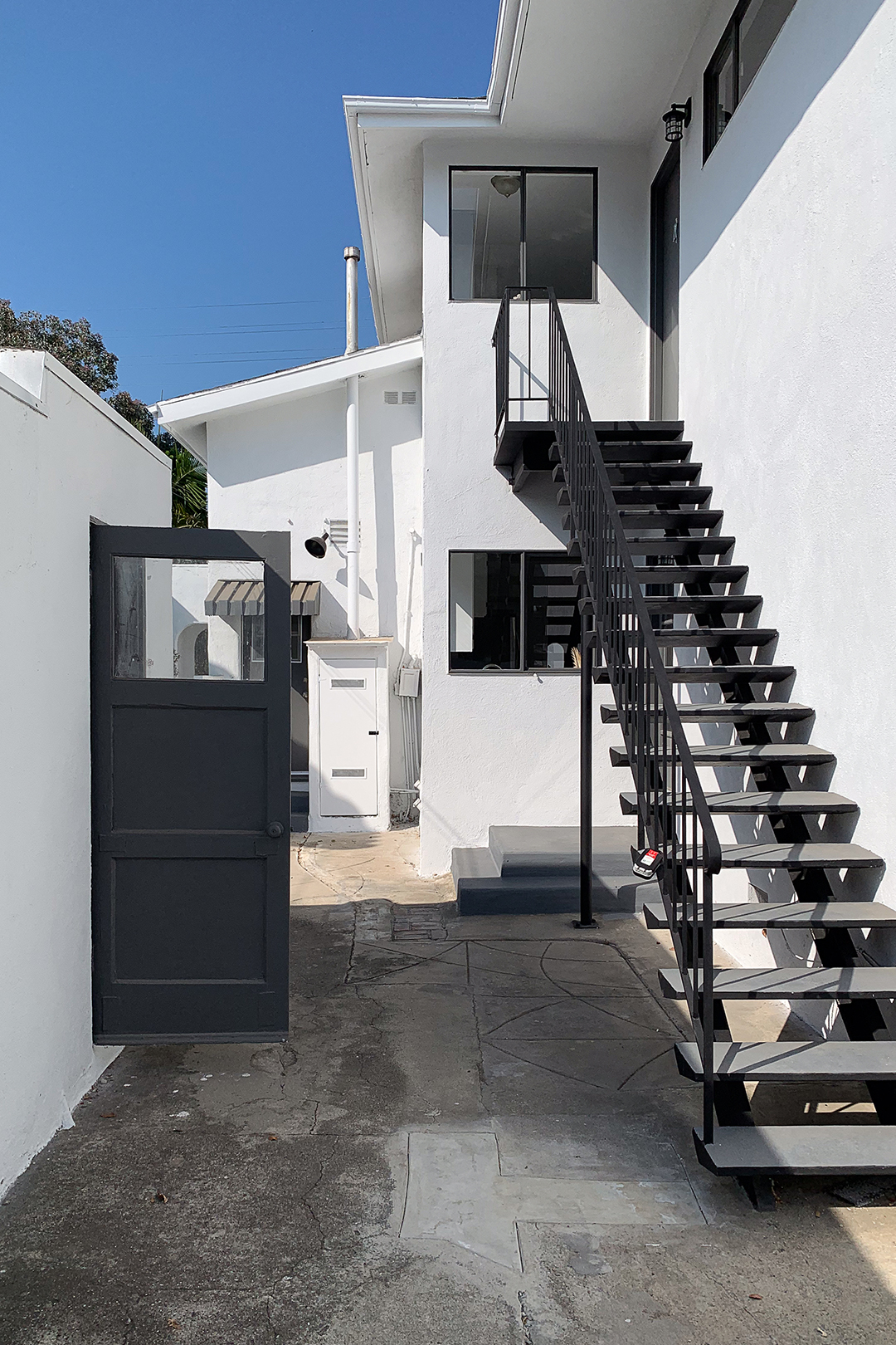 black and white exterior with concrete