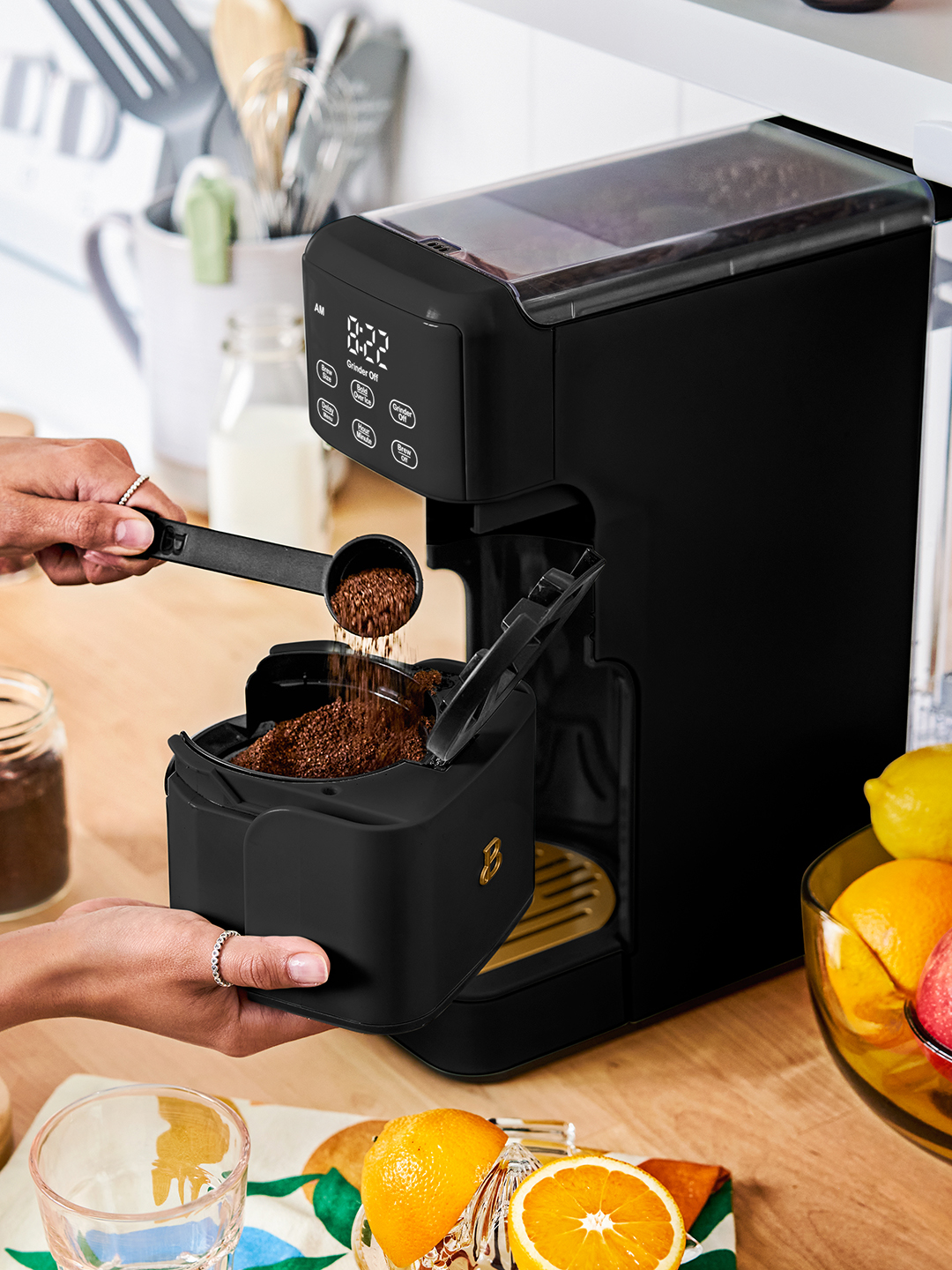 Ground coffee being put in a coffee maker