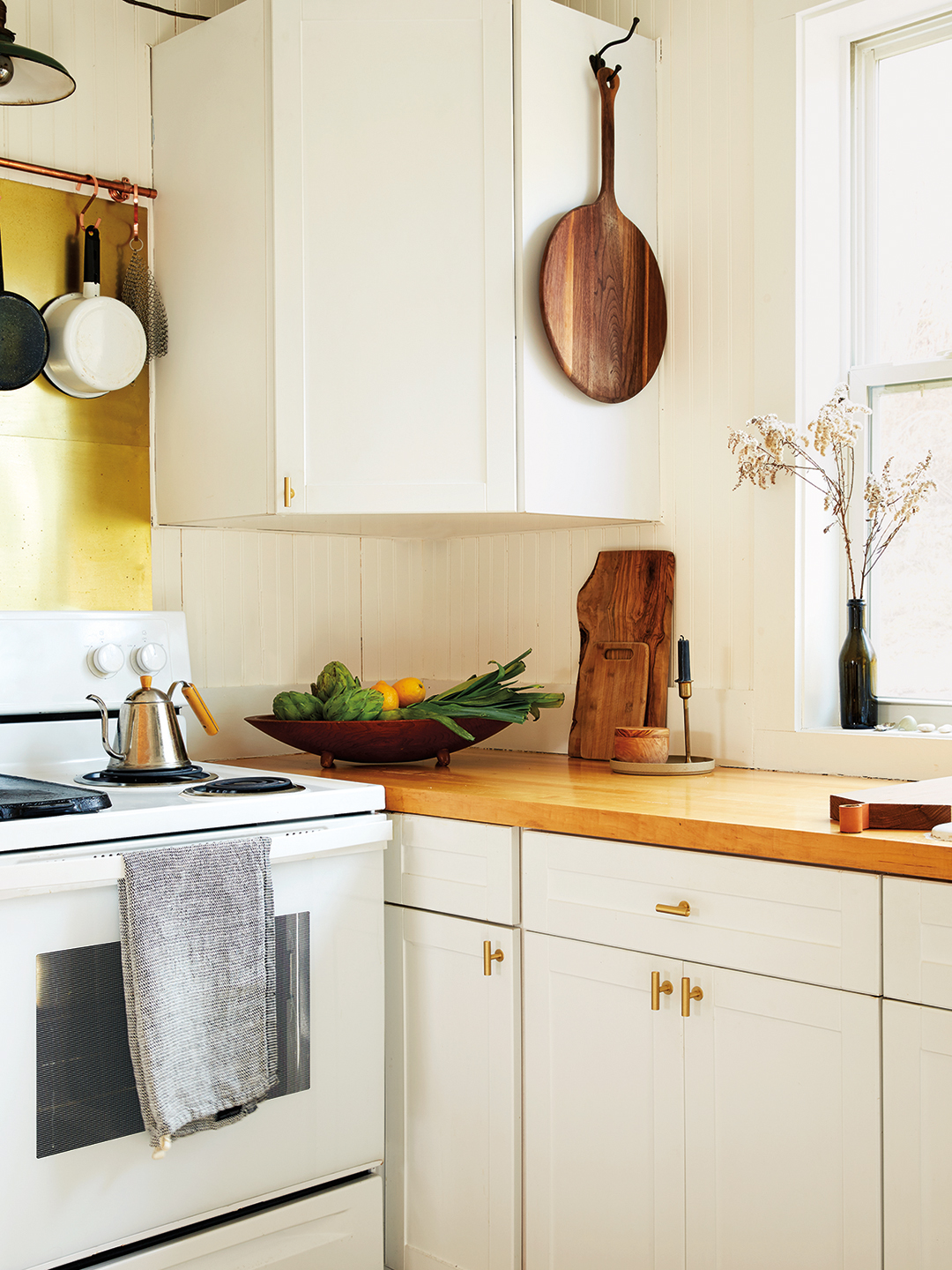 white cabinets with butcher block counters