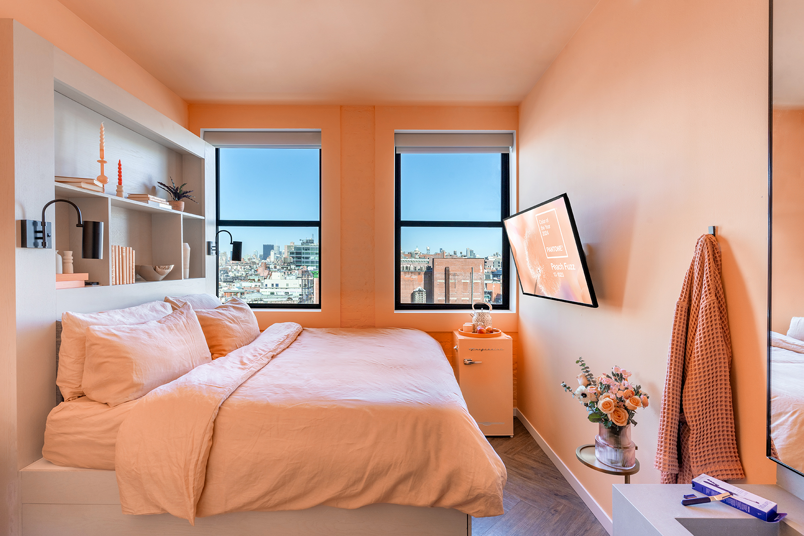 Walker Hotel Room with peach walls, bedding and fridge